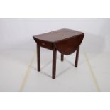 A 19TH CENTURY MAHOGANY DROP LEAF TABLE the oval hinged top raised on square moulded legs 70cm (h)