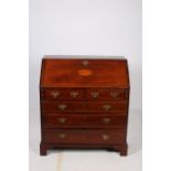 A FINE GEORGIAN MAHOGANY INLAID BUREAU the rectangular top above a hinged writing slope containing