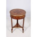 A CONTINENTAL KINGWOOD MARQUETRY AND GILT BRASS MOUNTED LAMP TABLE of circular outline the shaped