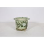 A GLAZED CHINA JARDINIERE the light green ground decorated with stylized foliage and flowerheads on