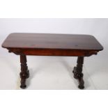 A VERY FINE REGENCY ROSEWOOD SOFA TABLE of rectangular outline with two frieze drawers on lobed