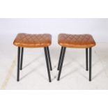 A PAIR OF RETRO HIDE UPHOLSTERED AND BLACK METAL LOW STOOLS each of rectangular seat with diamond