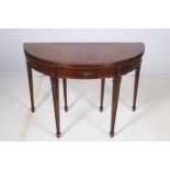 A GOOD HEPPLEWHITE DESIGN MAHOGANY FOLD OVER CARD TABLE of demilune outline the shaped top with