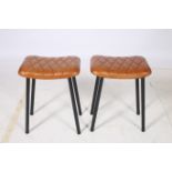 A PAIR OF RETRO HIDE UPHOLSTERED AND BLACK METAL LOW STOOLS each of rectangular seat with diamond