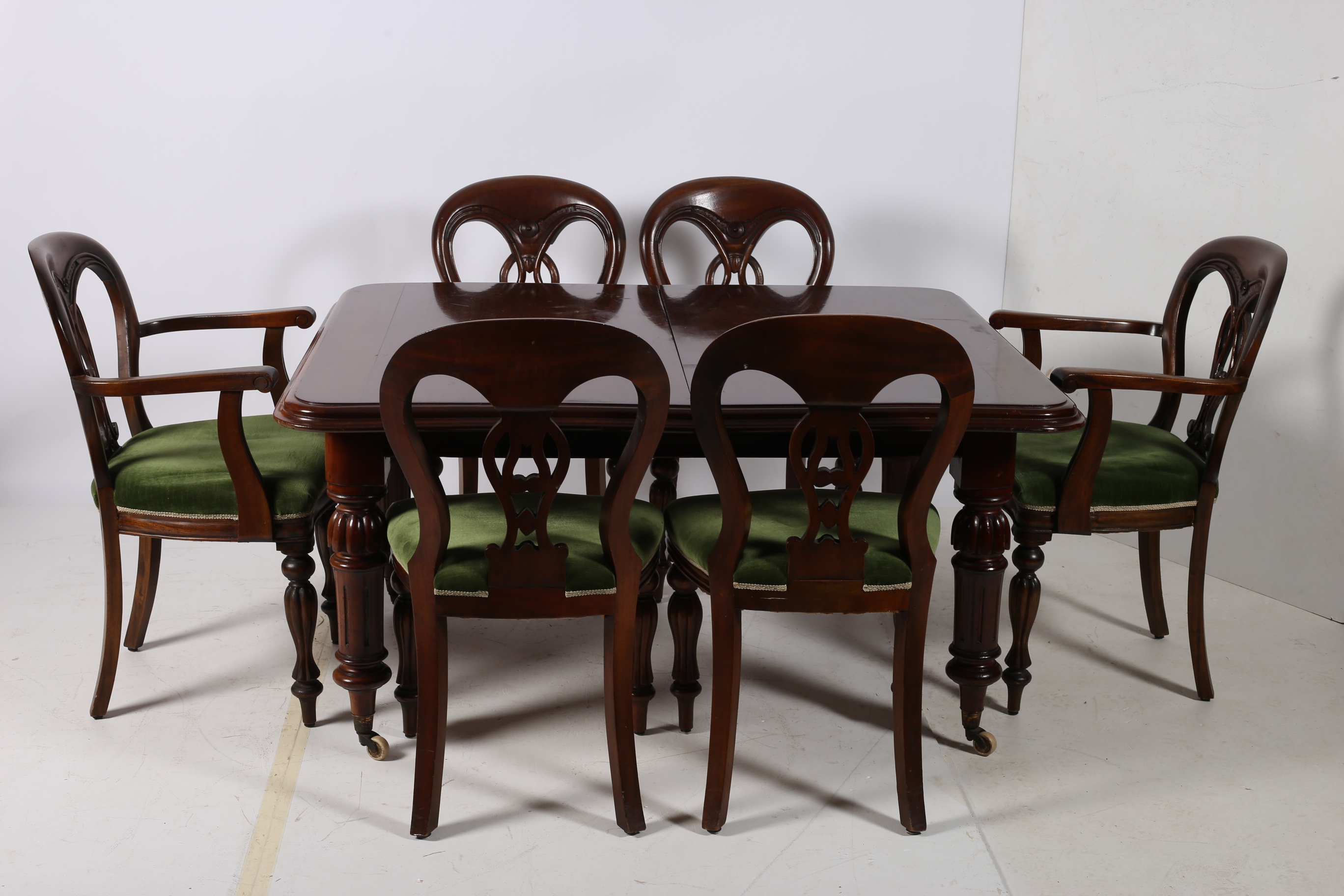 A 19TH CENTURY AND LATER MAHOGANY ELEVEN PIECE DINING SUITE comprising ten dining chairs each with