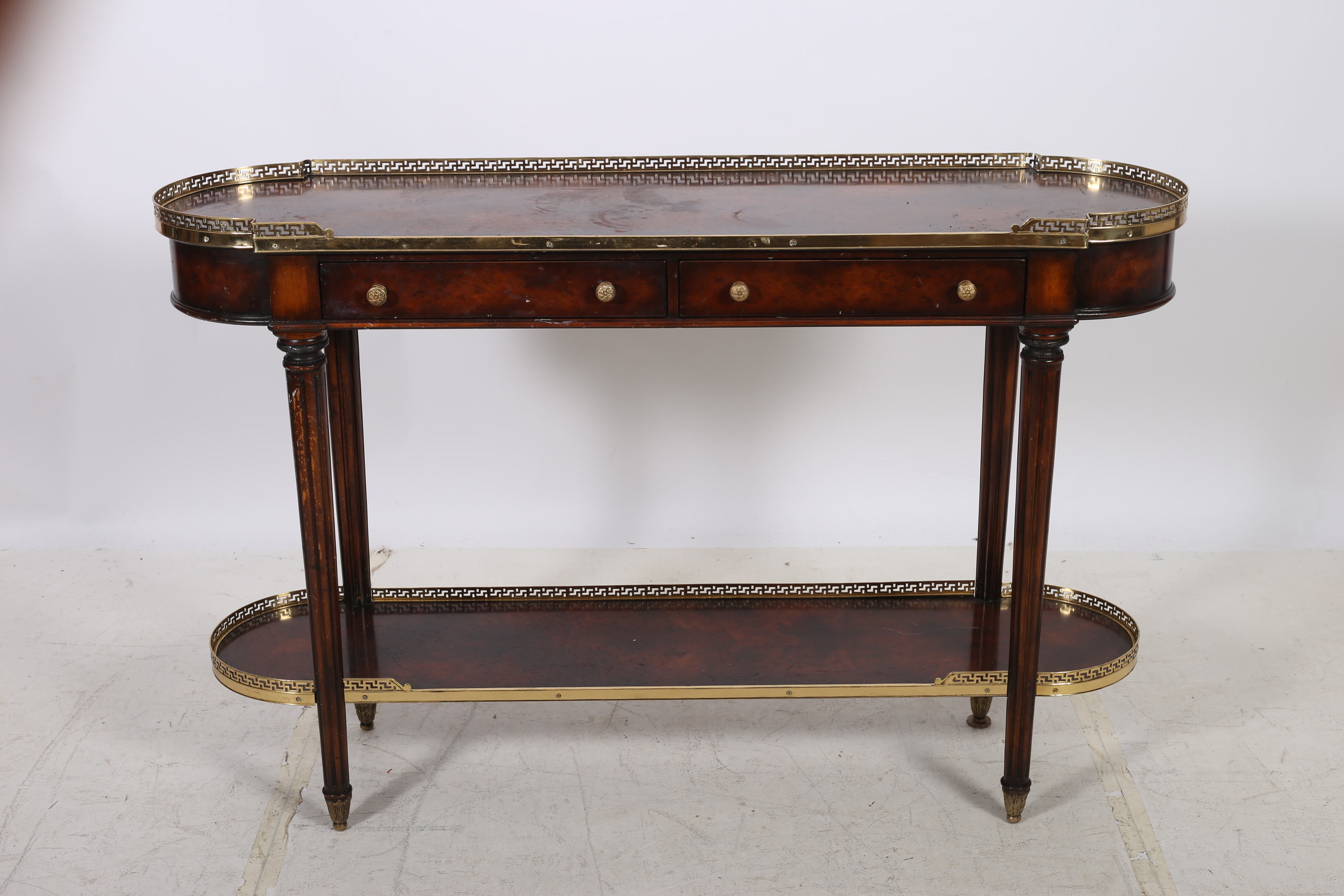 A REGENCY DESIGN WALNUT AND GILT BRASS MOUNTED SIDE TABLE the rectangular top with rounded ends and