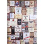 A FRAMED COLLAGE OF WHISKEY LABELS 83cm x 52cm