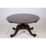 A MAHOGANY CROSS BANDED POD TABLE the oval top with one loose leaf raised on a baluster column with