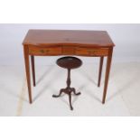 A SHERATON DESIGN MAHOGANY INLAID SIDE TABLE of serpentine outline the shaped top with two frieze