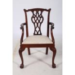 A CHILD'S CHIPPENDALE DESIGN MAHOGANY ELBOW CHAIR the carved top rail above a pierced vertical