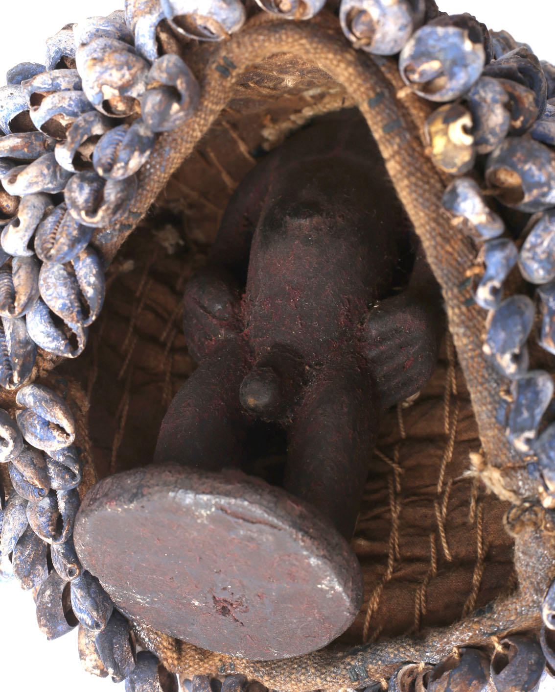 Tribal Art. A mid-20th century Yoruba Ibeji, a carved wood male figure with cowrie shell cloak. - Image 2 of 2