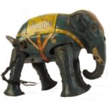 1930s German tin-plate clockwork elephant, by Blomer & Schuler, the dark grey body printed “Jumbo”,