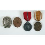 1939-1945 German Gold Wound Badge, Russian Front and West Wall Medals; and a DLR Sports badge.