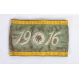 1916 Dublin Brigade, a commemorative armband, a pale green linen armband, with gold borders,