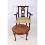 A GEORGIAN MAHOGANY ELBOW CHAIR with pierced vertical splat and upholstered seat with scroll arms