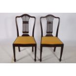 A PAIR OF 19TH CENTURY HEPPLEWHITE DESIGN MAHOGANY SIDE CHAIRS each with a shaped top rail and