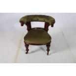 A 19TH CENTURY MAHOGANY AND UPHOLSTERED TUB SHAPED LIBRARY ARMCHAIR the button upholstered back and