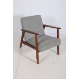 A RETRO TEAK AND UPHOLSTERED ARMCHAIR the rectangular and upholstered back and seat with moulded