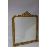 A CONTINENTAL GILTWOOD AND GESSO OVERMANTLE MIRROR the rectangular bevelled glass plate within a