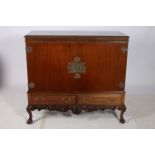 A CHIPPENDALE DESIGN MAHOGANY CUPBOARD of rectangular outline with gadrooned rim and panelled doors