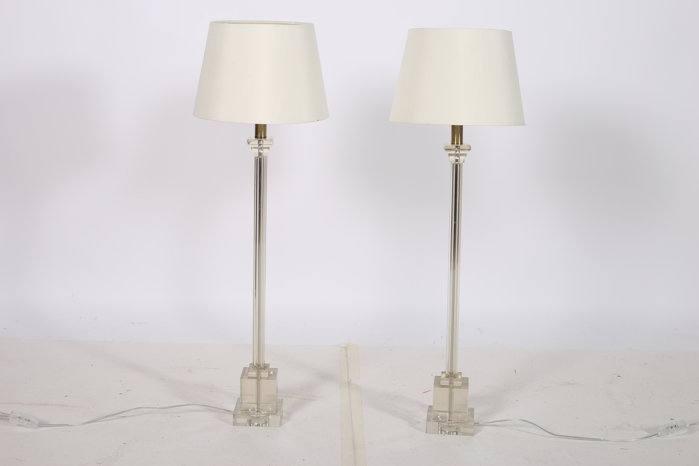 A PAIR OF CONTEMPORARY GLAZED TABLE LAMPS each with a square column above a square stepped base