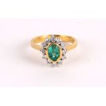 AN 18ct GOLD DIAMOND AND EMERALD DRESS RING