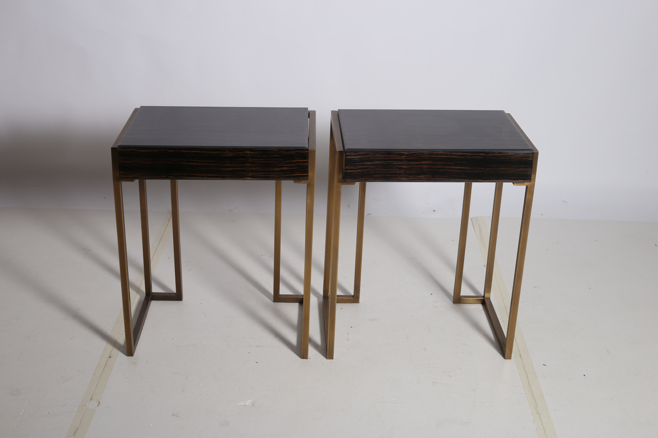 A PAIR OF SIMULATED ROSEWOOD AND GILT METAL LAMP TABLES each of rectangular form with frieze drawer