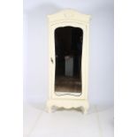 A CREAM PAINTED WARDROBE the moulded pediment with a shell and scroll decoration above a bevelled