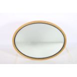 A CONTINENTAL GILTWOOD AND GESSO MIRROR the oval bevelled glass plate within a bead work moulded