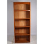 A GUATIER CHERRYWOOD INLAID OPEN FRONT BOOKCASE of rectangular bowed outline the shaped frieze