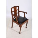 A VINTAGE HARDWOOD ELBOW CHAIR the ladder and panelled back with scroll arms and upholstered drop