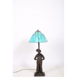 AFTER MILLARD A SPELTER FIGURAL TABLE LAMP modelled as Siffleur shown standing on a naturalistic