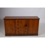 A ZEBRAWOOD AND SATINWOOD INLAID SIDE CABINET of rectangular outline the shaped top with four