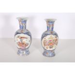 A PAIR OF 19TH CENTURY ORIENTAL VASES each of baluster form the white ground decorated with exotic