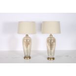 A PAIR OF TOPAZ GLAZED TABLE LAMPS each of ovoid tapering form on circular foot with shades 79cm