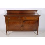 A CIRCA 1950s MAHOGANY SIDEBOARD of rectangular outline with two frieze drawers and cupboards and