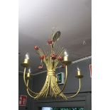 A CONTINENTAL GILT METAL FIVE BRANCH CENTRE LIGHT with flower head central column issuing five