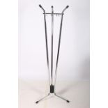 A RETRO CHROME FLOOR STANDING COAT RACK the triangular top raised on cylindrical columns with
