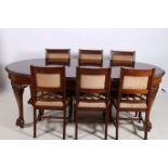 A CHIPPENDALE DESIGN MAHOGANY DINING TABLE of rectangular bowed outline with gadrooned rim raised