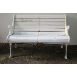 A CAST IRON AND HARDWOOD GARDEN BENCH