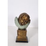 AFTER JS WESTMACOTT A BRONZE BUST OF A CHILD inscribed asleep raised on a black marble base 40cm