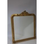 A CONTINENTAL GILTWOOD AND GESSO OVERMANTLE MIRROR the rectangular bevelled glass plate within a