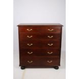 A 19TH CENTURY MAHOGANY CHEST of rectangular outline the shaped top with two short and four long