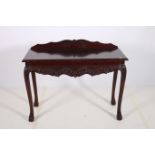 A CHIPPENDALE DESIGN MAHOGANY SIDE TABLE of rectangular outline with gadrooned rim and carved apron