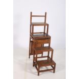 AN ARTS AND CRAFTS METAMORPHIC OAK LIBRARY CHAIR STEPS the upholstered back and seat opening to