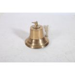 A VINTAGE BRASS BELL of typical form 23cm (h)