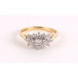 AN 18CT GOLD AND DIAMOND CLUSTER DRESS RING approx .