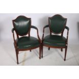 A PAIR OF HEPPLEWHITE DESIGN MAHOGANY AND HIDE UPHOLSTERED ELBOW CHAIRS each with a shield shaped