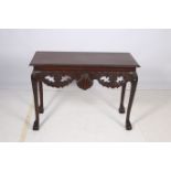 A CHIPPENDALE DESIGN MAHOGANY SIDE TABLE the rectangular top with gadrooned rim above a shell and