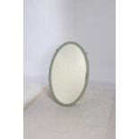 A REGENCY DESIGN LIGHT GREEN PAINTED MIRROR the oval plate within a reeded frame with stap work